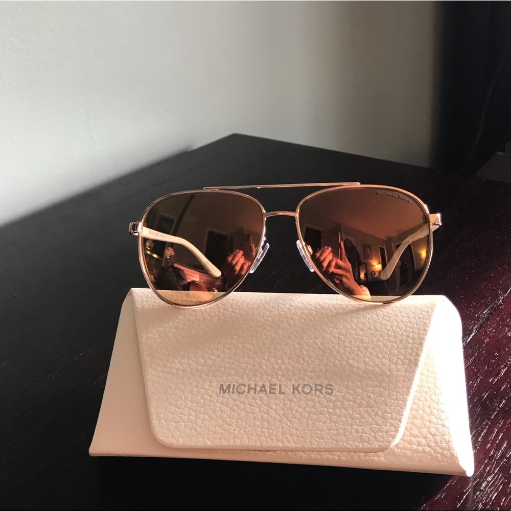 Micheal Kors aviators. Pink tint in lenses.